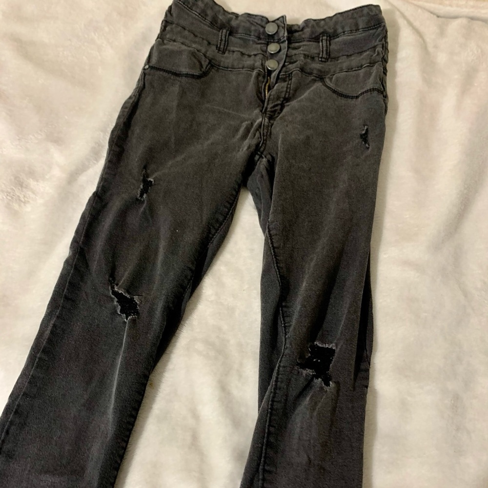 Distressed black ripped jeans